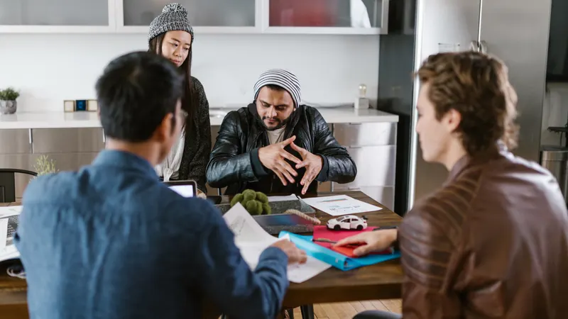 Agency team discussing white label versus in-house development